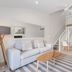 Caribbean Noosa in Noosa Heads: airy loft suite with sofa, dining area, staircase and balcony loft