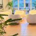Hotel La Plantacion in Finestrat lounge with white armchairs and garden-view windows