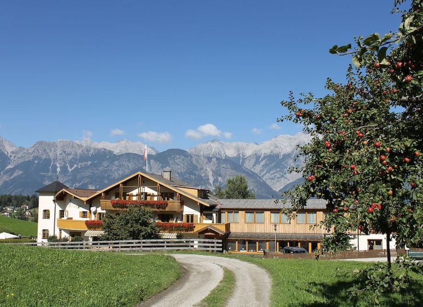 Hotel Geisler Tulfes in Tulfes with mountain backdrop and countryside setting