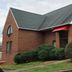 Red Roof Inn & Suites Cornelius - Lake Norman exterior with brick facade and red awnings in Cornelius