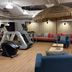 Baselite-Westbund Serviced Apartment in Shanghai lounge with seating area and gym equipment