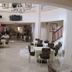Tabarre's Palace in Port Au Prince: elegant hotel dining room with white-tablecloth tables and chandeliers