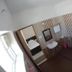 Sr Residency in Tiruchirappalli bathroom with toilet, sink, mirror, shower area and bucket