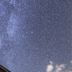 Pension Hoshi Ni Negaiwo in Furano under a star-filled night sky with Milky Way above the roof