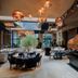 Sky Blue Hotel & Spa Ploieşti restaurant with copper hood, pendant lights and table seating