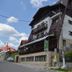 Magic Club in Bușteni, alpine-style hotel exterior with balconies and sloped roof