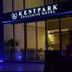 Kentpark Exclusive Hotel in Kahramanmaraş exterior at night with blue-lit entrance and glass doors