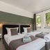 Hotel Enger Hof in Düsseldorf guest room with twin beds and a window view
