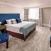 Newton Country Hotel Burton guest room with king bed, desk, and window in Burton upon Trent