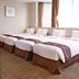 Hotel Skypark Myeongdong Ii in Seoul: bright triple room with three neatly made beds