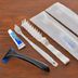 Value the Hotel Ishinomaki amenity kit with toothbrushes, razor and toothpaste on a table