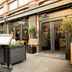 Victory House London entrance with outdoor terrace seating on a London street
