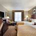 Comfort Inn & Suites Glen Mills - West Chester room with two beds, TV, desk, and window seating