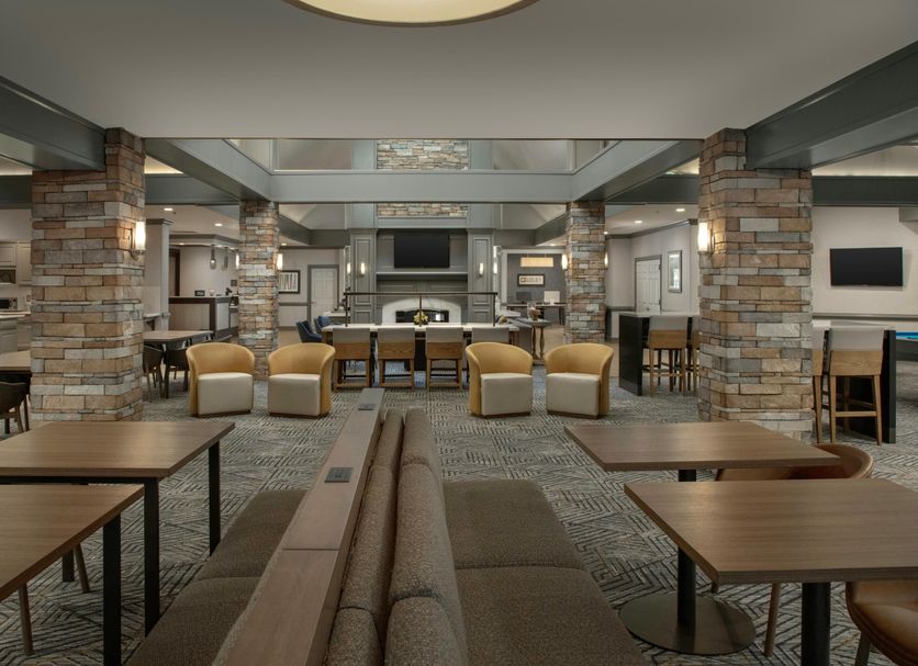 Homewood Suites by Hilton Alexandria/Pentagon South lobby with seating, tables and fireplace in Alexandria