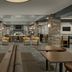 Homewood Suites by Hilton Alexandria/Pentagon South lobby with seating, tables and fireplace in Alexandria