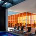 Fiesta Inn Morelia Altozano indoor pool with lounge chairs and glass-walled fitness area