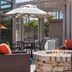 Hyatt House Emeryville/San Francisco Bay Area patio with fire pit, outdoor seating, and umbrella table