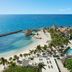 Dreams Aventuras Riviera Maya in Puerto Aventuras with ocean views, beach, palm trees and pools