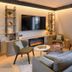 Campanile Nature - Paris Ouest Gennevilliers Port lounge with sofa, chairs, fireplace and TV in Gennevilliers