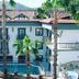 Orange Garden Aparts & Hotel The Nordic in Kemer with pool, palm trees, and mountain backdrop