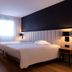L'Amirauté Brest hotel room in Brest with two twin beds and window light