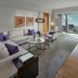 Mandarin Oriental, Tokyo suite with city skyline view, sectional sofa, dining table and desk