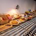 Breakfast buffet at ibis Haguenau Strasbourg Nord in Haguenau with breads, pastries, fruit, and coffee