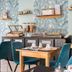 Deltour Hotel Le Puy En Velay breakfast area with buffet and teal chairs in Le-Puy-en-Velay