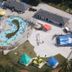 Aerial view of Motel 6 Greenville - Simpsonville water park with pools, slides, and lounge areas in Simpsonville