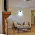 Night Swan Intracoastal B&B in New Smyrna Beach guest room with king bed, sitting area, and hardwood accents