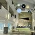 Sand & Sandals Desaru Beach Resort & Spa lobby in Bandar Penawar with hanging orb lights and reception desk