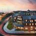 Club Wyndham Long Wharf in Newport with marina view at dusk and illuminated waterfront buildings