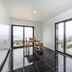 You and the sea in Ericeira: modern kitchen with dining table and large windows overlooking the sea.