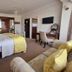 The Coast Yard B & B and Garden Chalets in Chichester guest room with bed, desk and sofa