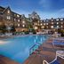 Club Wyndham Long Wharf in Newport with outdoor pool and lounge chairs at dusk