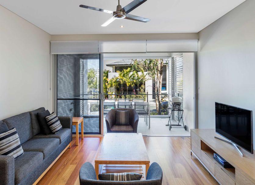 RACV Noosa Resort living room with sliding doors to a private balcony in Noosa Heads