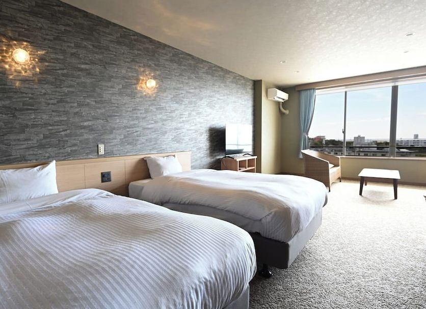 Taoya Shirahama Senjyo guest room with twin beds and balcony window view in Shirahama