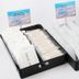 Smile Hotel Aomori breakfast trays with packed utensils and condiments on a white surface