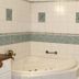 Hotel Seltenbacher Hof Tuttlingen bathroom with corner jetted bathtub and glass shower