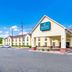 Quality Inn & Suites Canton, Ga exterior in Canton with parking lot and clear blue sky