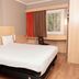 ibis Santiago Las Condes guest room with double bed, desk, chair, and window in Santiago