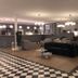 Tyringe Kurhotell lobby lounge in Hässleholm with sofas, chandeliers, and black-and-white tile flooring