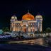Hotel Tibera Taman Cibeunying in Bandung, illuminated palace-like building at night with parking area