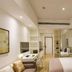 The Clouds Apartment in Shenzhen guest room with bed, desk, chair, TV, and mirrored wardrobe