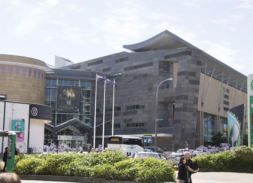 Mantra Wellington Central in Wellington exterior with modern facade, flags, and landscaped entrance