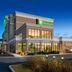 Holiday Inn & Suites Red Deer South by IHG exterior at dusk with lit windows and entrance