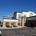 Wingate by Wyndham Coon Rapids exterior with covered entrance and blue sky