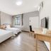 7 Days Inn Guangzhou Beijing Road Metro Branch guest room with two beds, desk, TV, and window