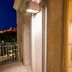 Palace Hotel Vieste balcony with moonlit view over Vieste and a bedroom with canopy bed