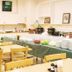 Breakfast buffet area at Smile Hotel Kumagaya in Kumagaya with tables, chairs, and serving dishes